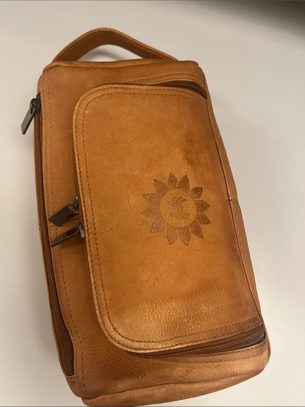 Source Unknown Tan Leather Toiletry Bag with Embossed Sun Motif